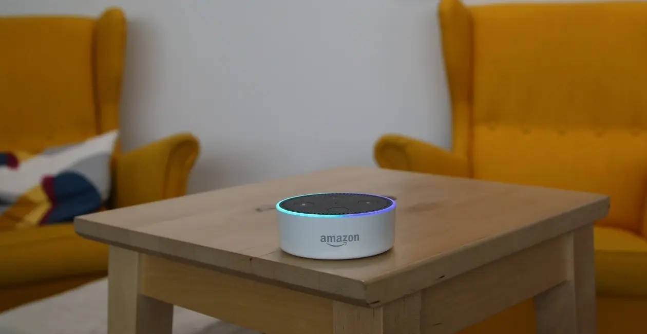 An Amazon Echo sitting on a tabletop