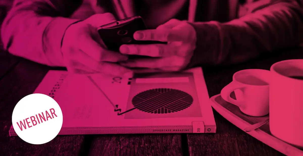 Someone sitting at a table with a cup of coffee, working on their phone (magenta saturated image) with a webinar label overlayed