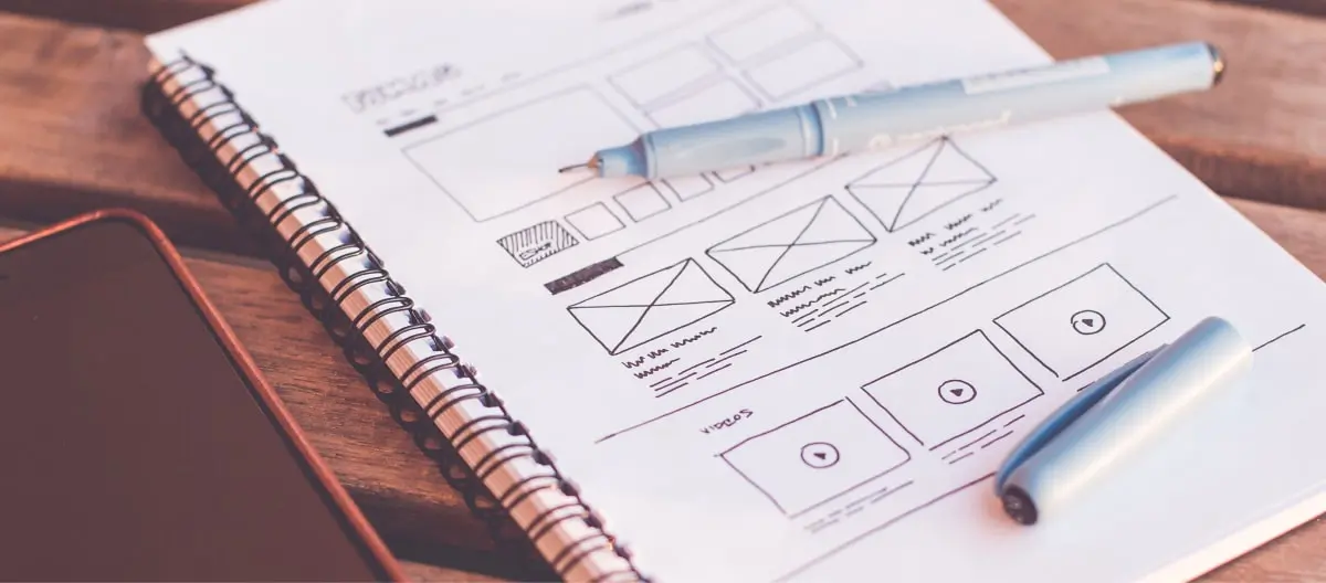 UX Design Tools: A paper prototype sketched out on a notepad in pen