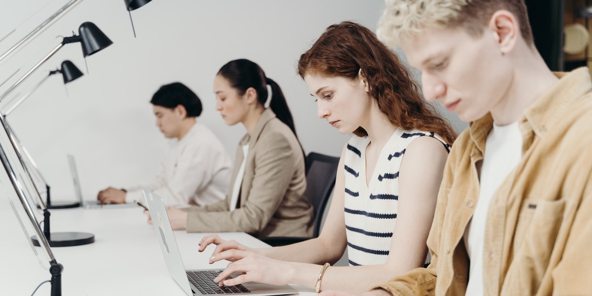 startup programmers office Developers sitting in a startup office using the most popular programming languages.