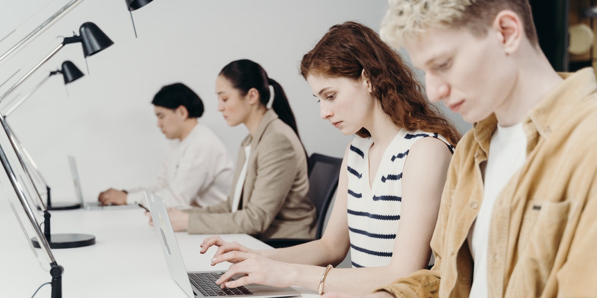 Developers sitting in a startup office using the most popular programming languages.