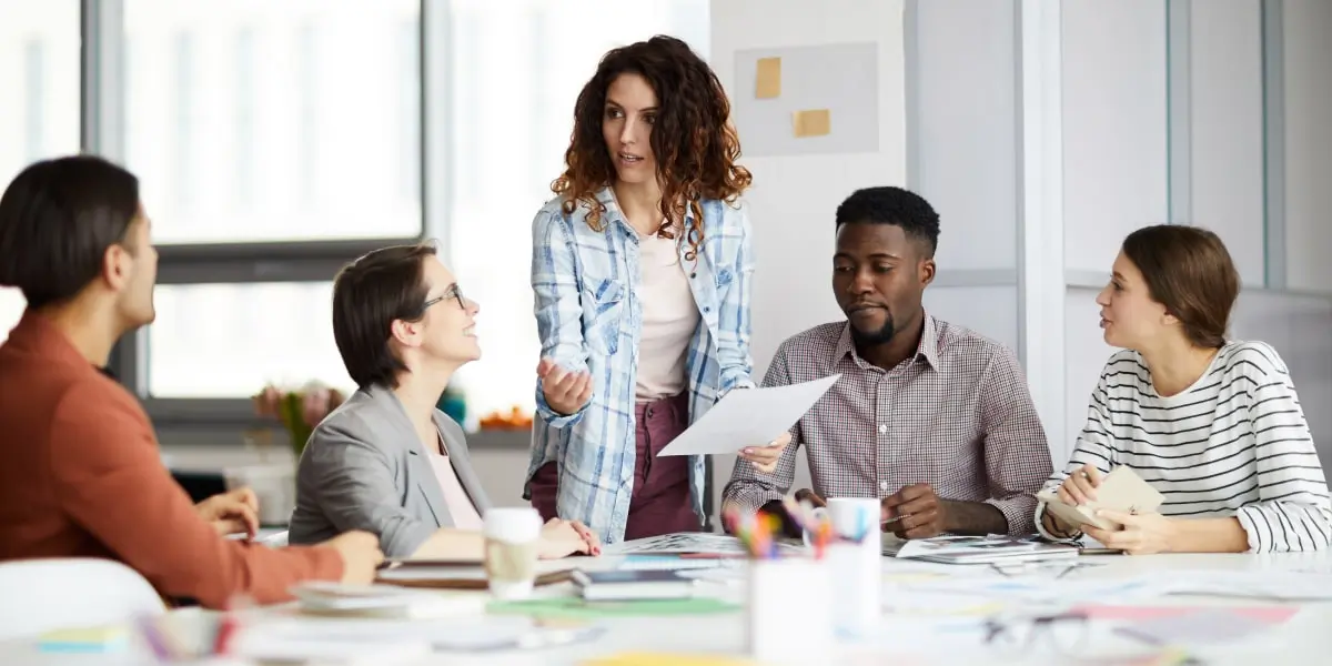 A group of people working in an office as part of their digital marketing internship