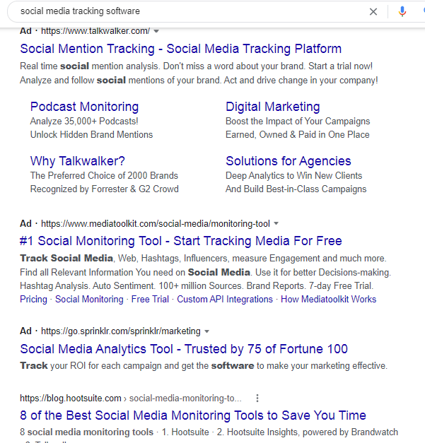 A screenshot of paid ads and organic results in the Google search results page when searching for social media tracking software on Google