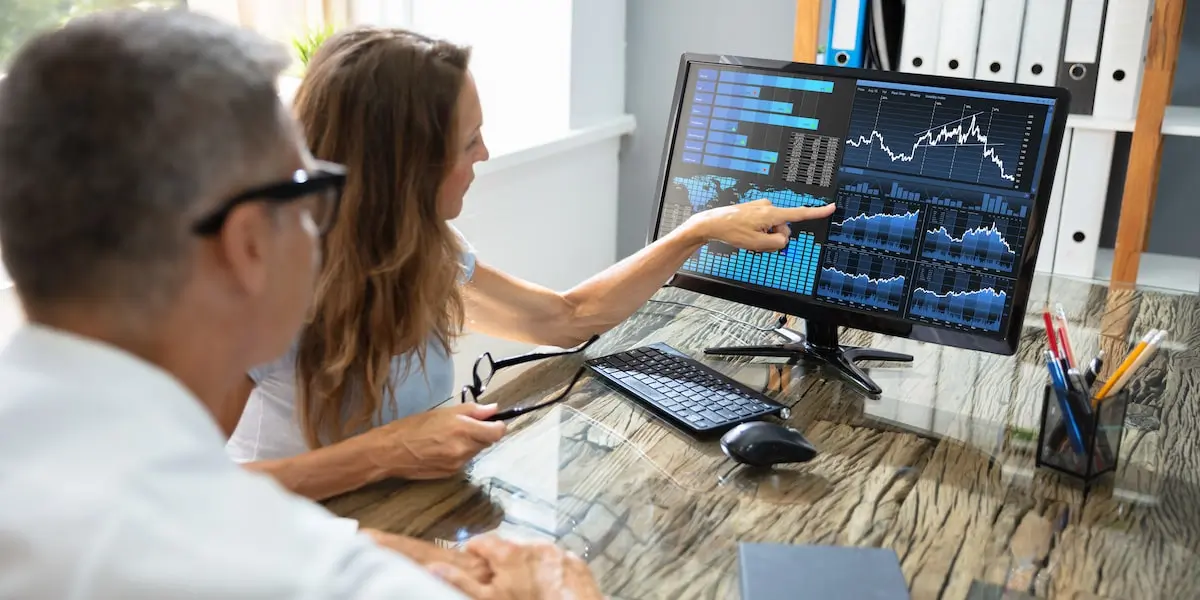 predictive analytics tools Data analyst colleagues look at visualizations made by predictive analytics tools