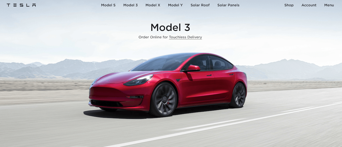 Screenshot of the Tesla homepage, with a car dominating the screen, an example of visual hierarchy.