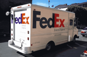 white fedex truck with fedex logo using the design principle of white space