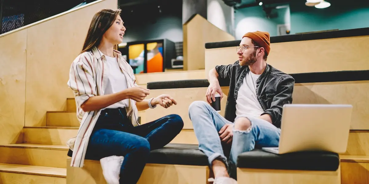 social media marketing Two people working on social media marketing in a co-working space