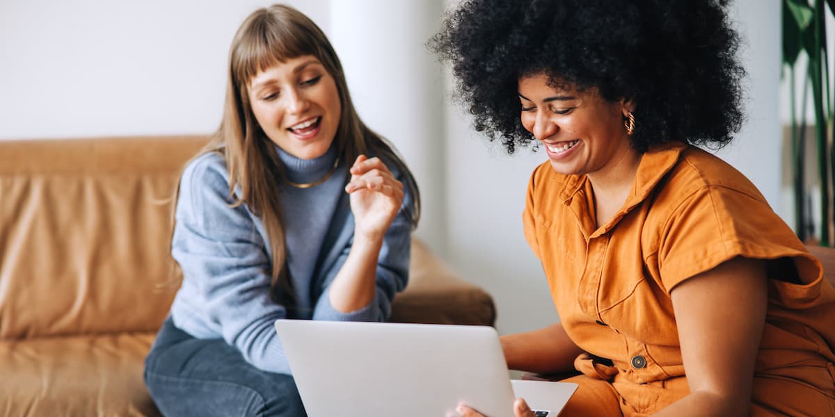 two career changers use a laptop to take a tech career quiz