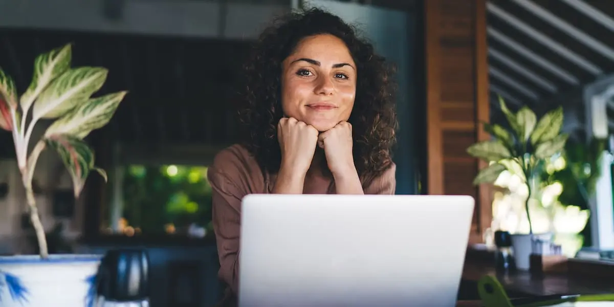 Woman at laptop after making a career change at 40