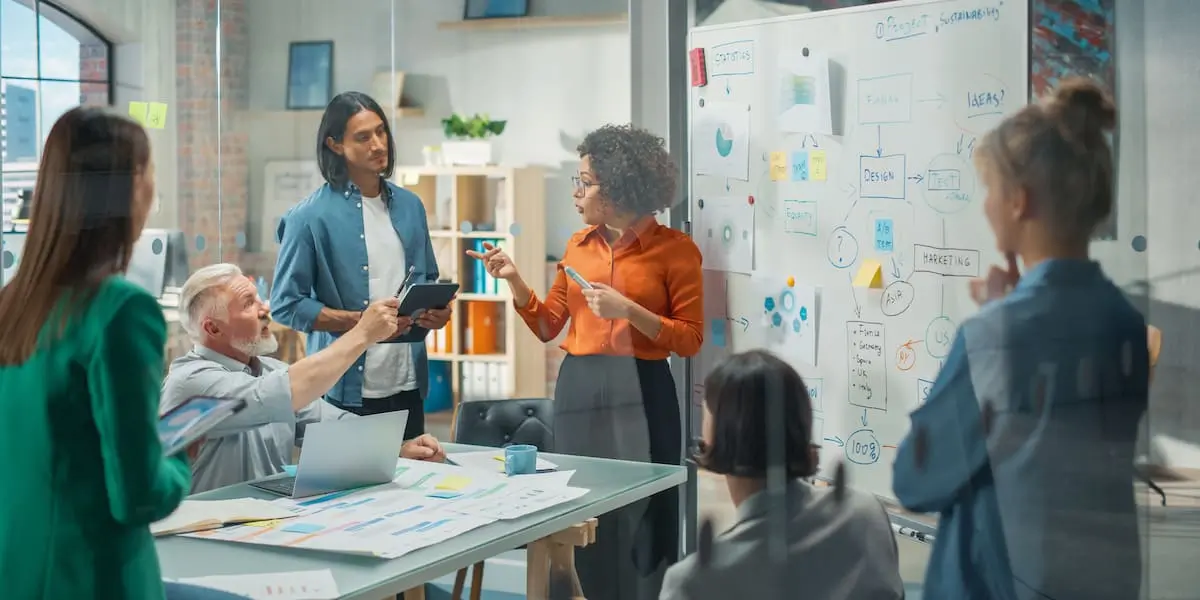 presenting these charts is simple A product manager presenting a burndown chart to her whole team in an office.