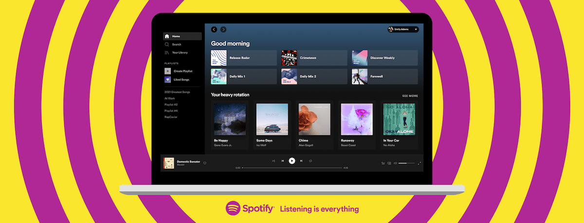 An image of a laptop with the Spotify desktop app open on it.