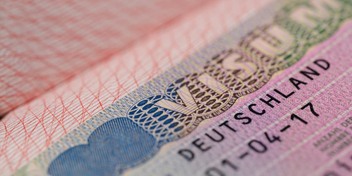 A close up photograph of a German visa.