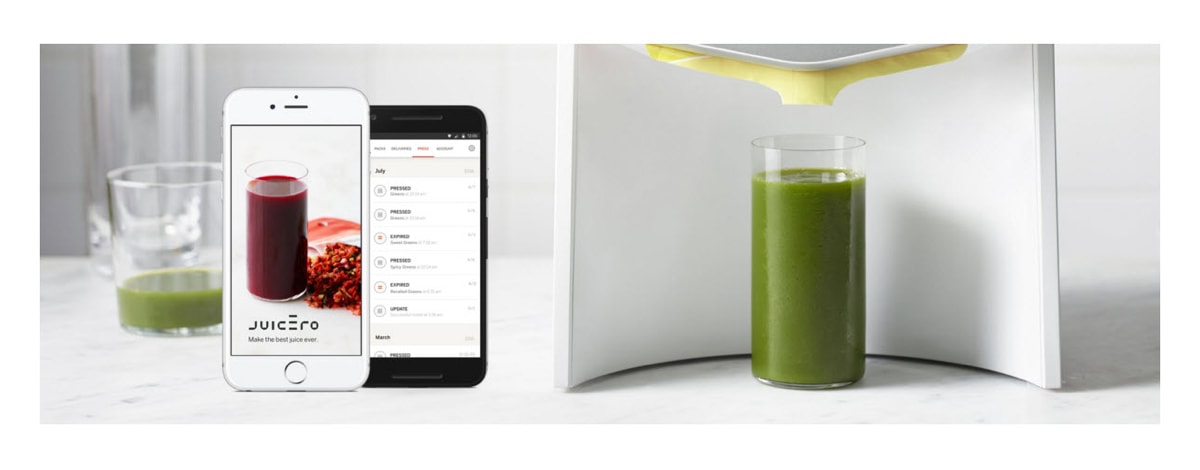 Juicero phone application displayed on an iPhone next to a glass of juice